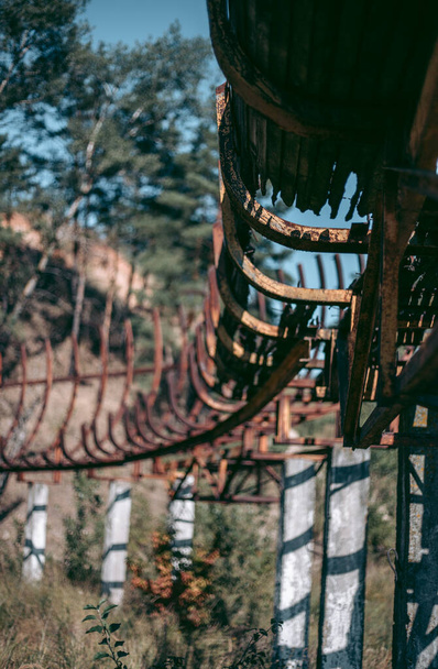 Old abandoned wooden bobsleigh track in summer by daylight - Photo, Image