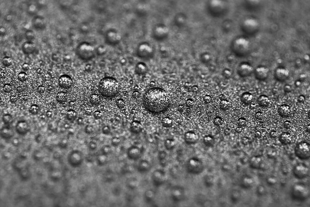 Abstract gray texture with water drops and metal surface close-up. Beautiful bright droplets shot with selective focus. - Фото, изображение