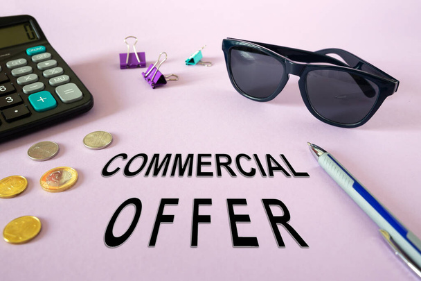 Concept: Commercial Offer. Calculator, money and glasses on the table - Photo, image