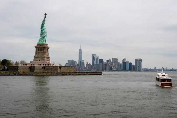 New York, USA - June 7, 2019: Ferry Boat approaching the Statue of Liberty, Liberty Island - Image - Fotó, kép