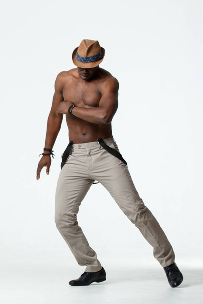 Athletic black man dancing, on a white background. - 写真・画像