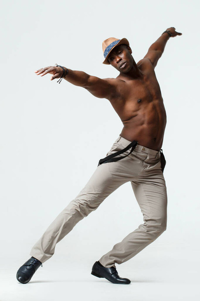 Athletic black man dancing, on a white background. - Фото, зображення