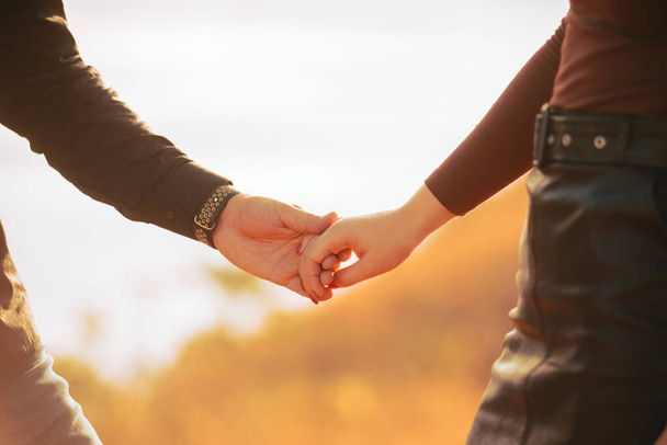 A young man and woman holding hands - Photo, image