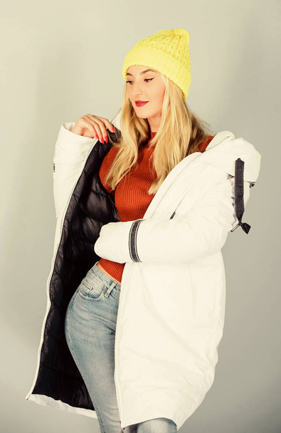 Add some action to your life. beauty in winter clothing. cold season shopping. woman in padded warm coat. winter holidays. New year. flu and cold. seasonal fashion. girl in beanie. faux fur fashion - Foto, Imagem