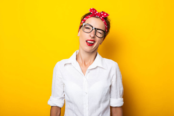 Young woman with a bandage on her head makes a bored gesture on a yellow background. Banner. - Foto, Bild