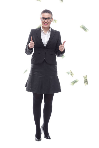 in full growth. happy businesswoman standing among dollar bills. - Фото, зображення