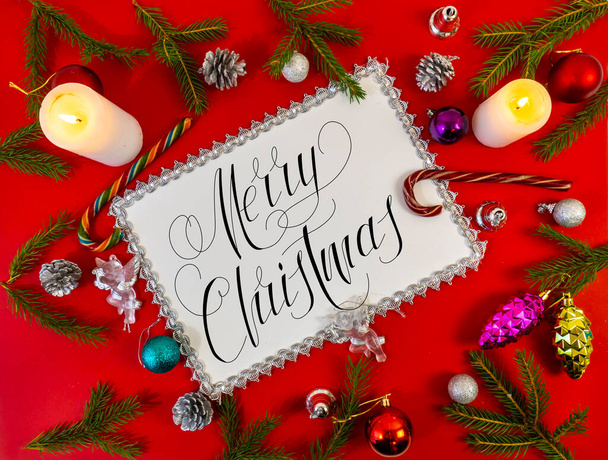 Christmas card, banner, flatlay with text - Merry Christmas on a red background - Φωτογραφία, εικόνα