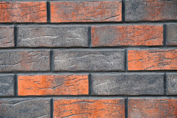 brown mottled decorative brick wall for background close up - Photo, Image