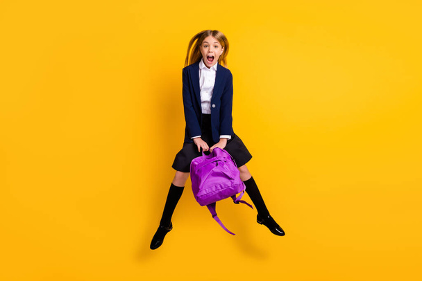 Full length body size view of her she small little cheerful amazed funky girlish girl jumping having fun after class new collection clothes isolated bright vivid shine vibrant yellow color background - Foto, Imagem
