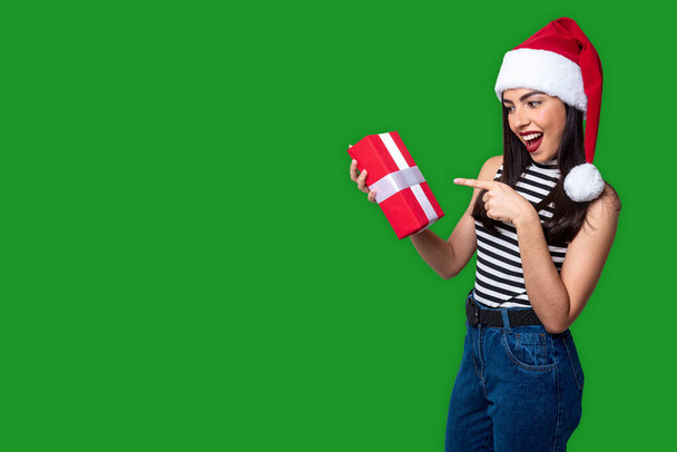 Santa Claus woman holding a gift, isolated on background with space for copy. - Photo, Image