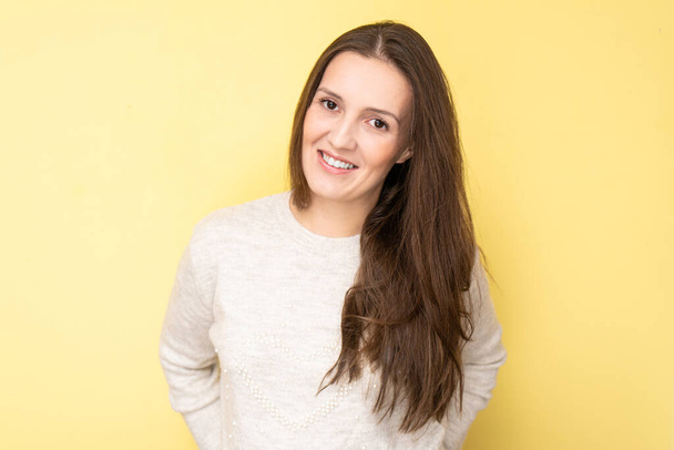 Happy attractive tatar young woman smiling and laughing isolated on yellow background with copy space, face portrait - Zdjęcie, obraz