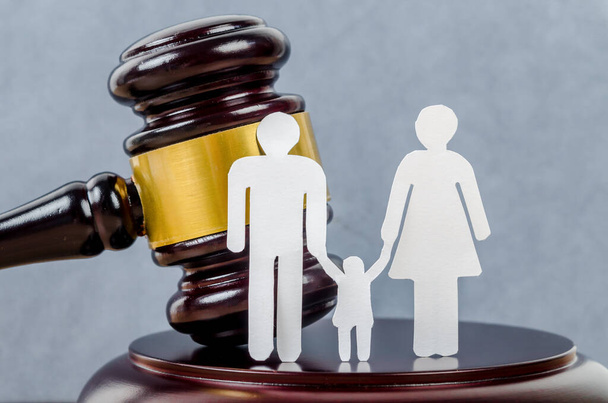 Family figure and gavel on table. Family law concept - 写真・画像