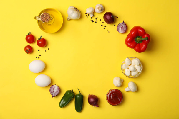 Ingredients for cooking on yellow background, top view - Фото, зображення