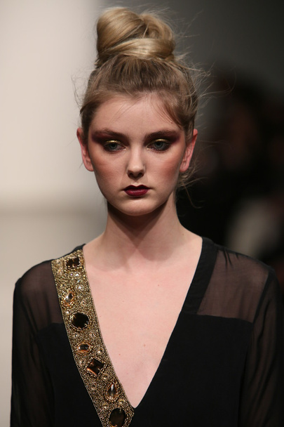 Model walks runway at Naveda Couture show - Фото, изображение