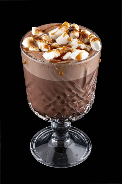 Cocoa with marshmallows and caramel. On dark background - 写真・画像