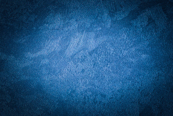 Blue decorative plaster texture with vignette. Abstract grunge background with copy space for design. - Foto, afbeelding