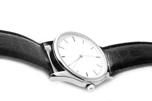 Запястные часы с черным ремешком
 - Фото, изображение