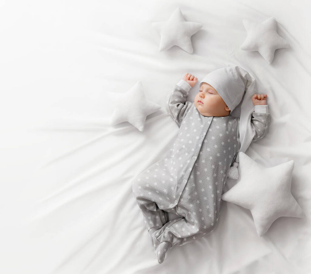 Cute sleeping baby in the bed - Photo, Image