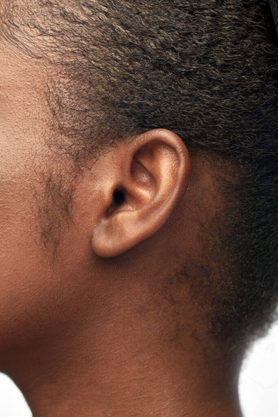 close up of african american womans ear - Fotoğraf, Görsel