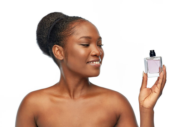 young african american woman with perfume - Fotoğraf, Görsel