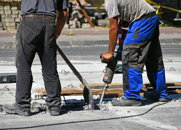 Men are working at the road construction - Photo, Image