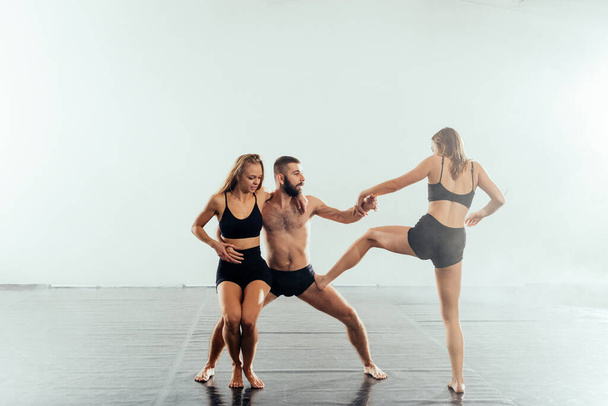 Group of contemporary dancers practicing a dance routine - Photo, Image