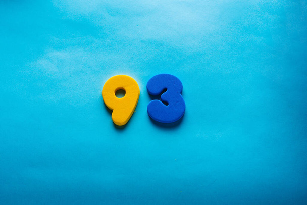 Number on a bright blue background. - Fotoğraf, Görsel