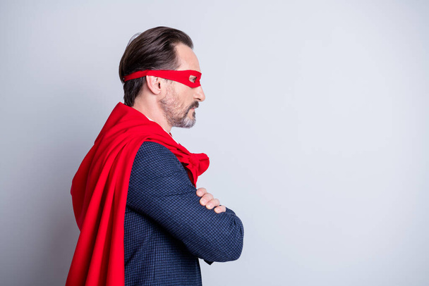 Profile photo of serious confident aged mature business guy arms crossed corporate party theme super hero costume look empty space wear blue suit red face mask cloak isolated grey background - Foto, immagini