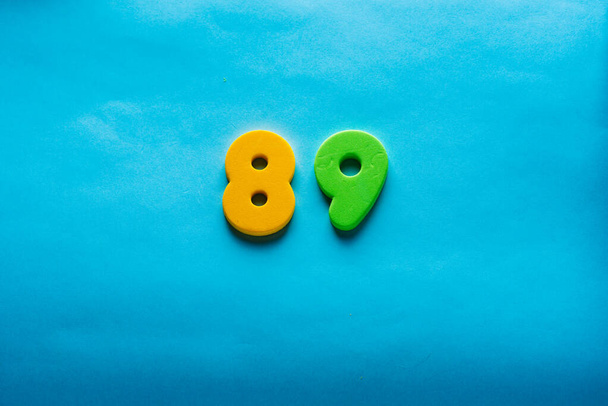 Number on a bright blue background. - Foto, immagini