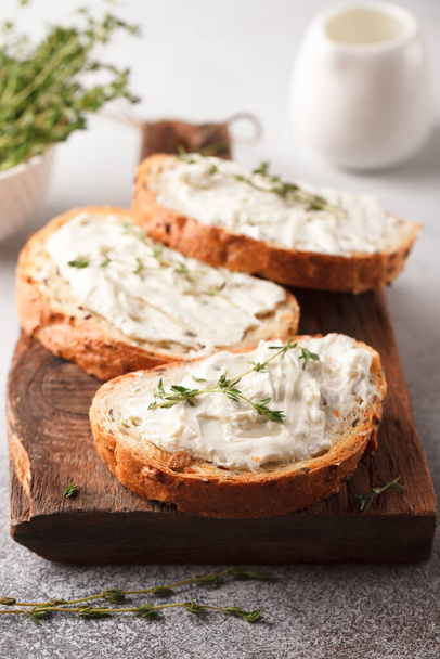Sandwiches with cheese and thyme. Lunch with toast. Toasts on a light background - Photo, Image
