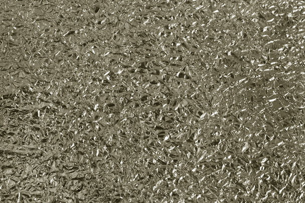 Λαμπερό ασημί φύλλο υφής φόντο, μοτίβο του χαρτιού περιτυλίγματος με τσαλακωμένο και κυματιστό. - Φωτογραφία, εικόνα