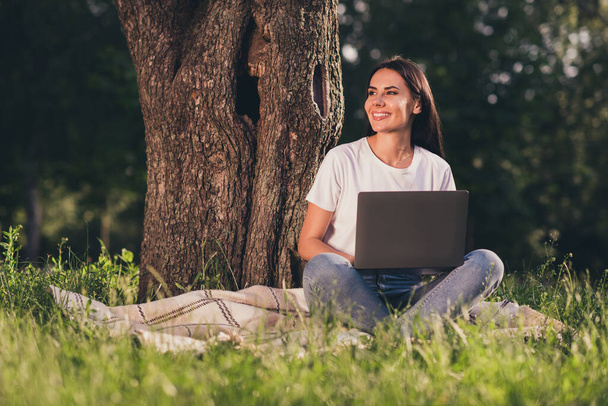 Portrait of her she nice attractive cheerful cheery glad successful girl creative designer specialist programmer sitting on lawn green grass veil duvet working remotely - Foto, afbeelding