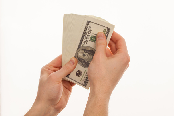 isolated hand with pack of one hundred dollars  - 写真・画像