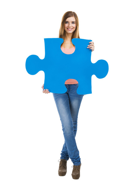 Woman holding a puzzle piece - Foto, Bild