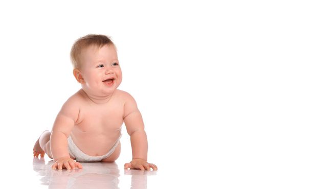 Little baby child smiling and crawling isolated on white in studio. - Fotoğraf, Görsel