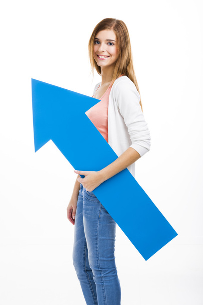 Woman holding a blue arrow - Foto, Imagen