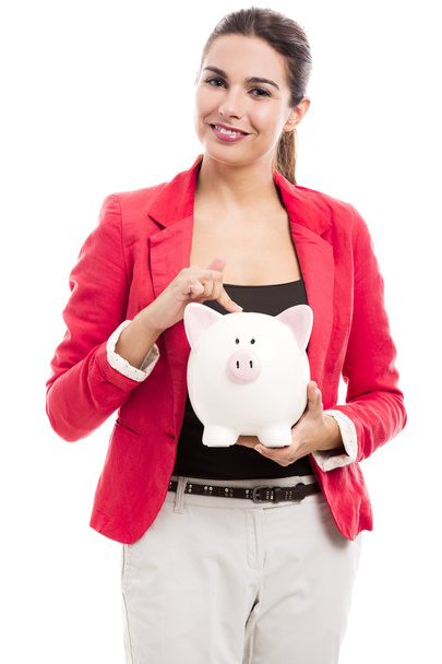 Business woman with a piggy bank - Foto, afbeelding