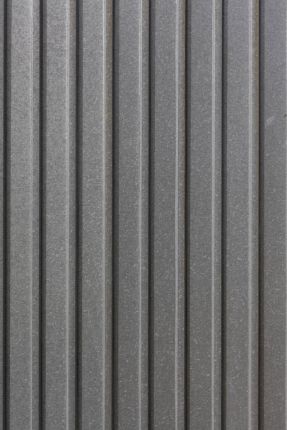 Metal fence made of corrugated boar - Φωτογραφία, εικόνα