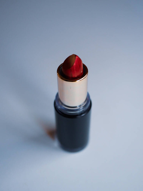 red lipstick on a white table - Fotoğraf, Görsel