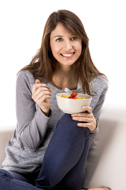 Woman  eating  fruit salad - Фото, изображение