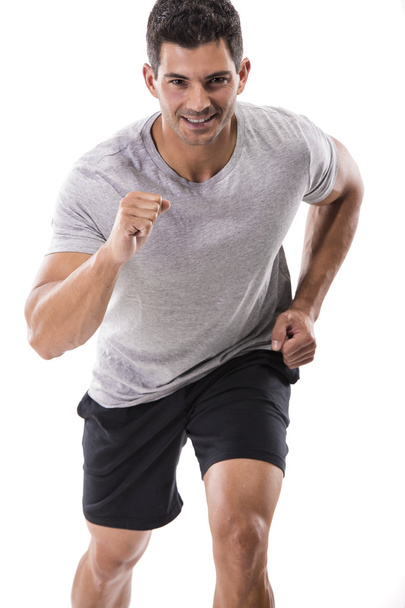 Athletic man running - Foto, afbeelding