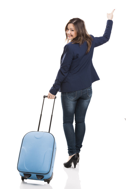 Business woman carrying a suitcase - Foto, Imagen