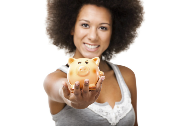 Woman with a piggy bank - Foto, afbeelding