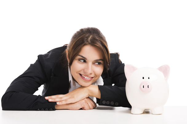 Businesswoman with a piggy bank - Foto, afbeelding