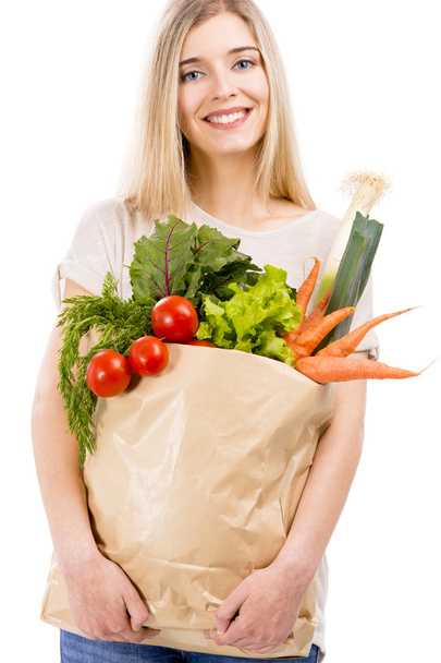 Mujer llevando bolsa de verduras
 - Foto, imagen
