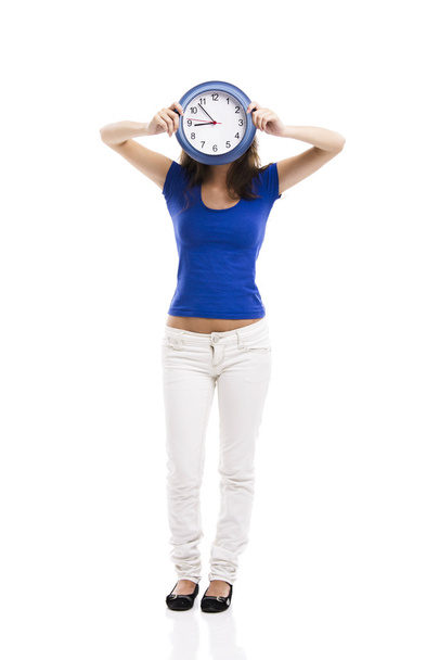 Beautiful woman with a clock - Фото, изображение