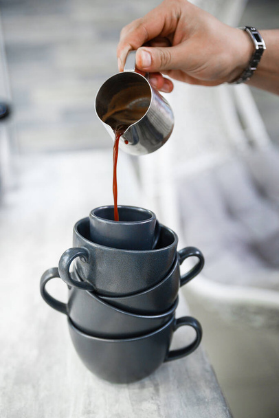 Cup of invigorating espresso in the morning. Preparing espresso coffee in an unusual way. - 写真・画像