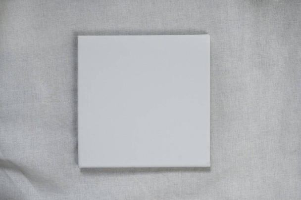 white rectangular canvas on natural fabric cotton texture background - Fotó, kép