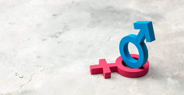 Gender-Symbole von Mann und Frau auf grauem Hintergrund - Foto, Bild