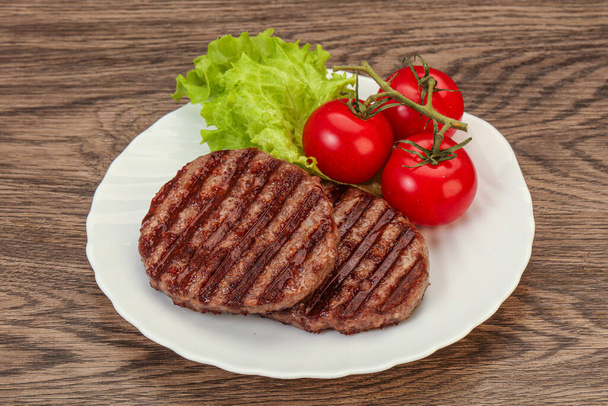 Grilled burger cutlet with tomato sauce - Photo, Image